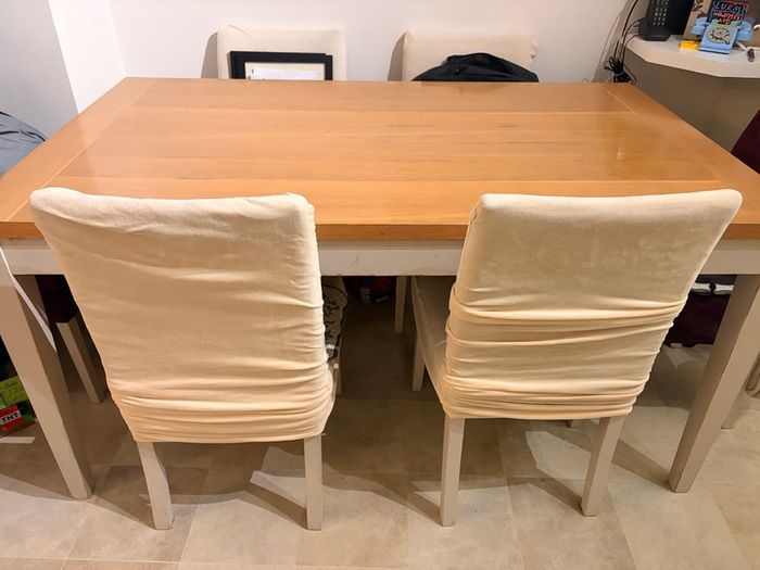 Dining table with wooden top and painted legs