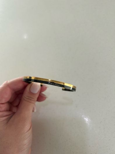 Calvin Klein black and gold bangle