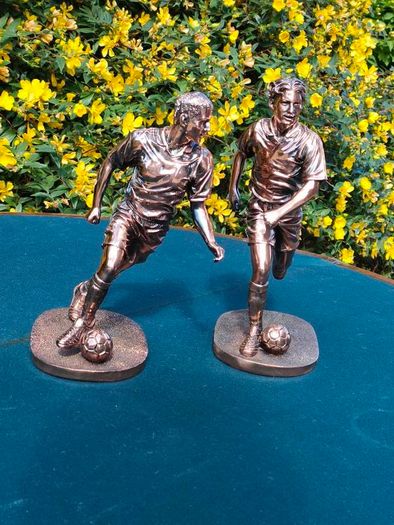 Two Gilded footballers