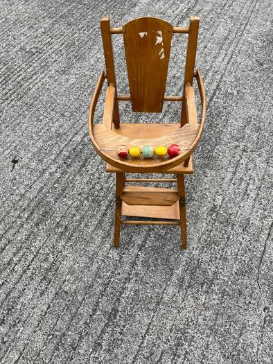 Vintage wooden doll high chair FROM THE 1930S featuring a built-in play tray with a wire bead