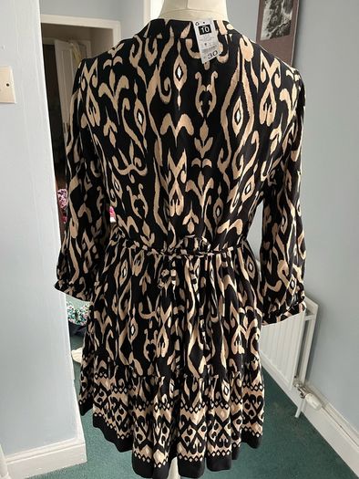Brand new black and beige long sleeved mini dress