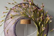 ladies hat for racing worn on the back of the head called a halo.