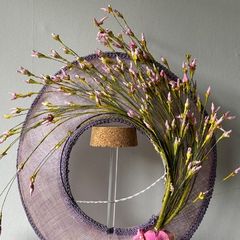 ladies hat for racing worn on the back of the head called a halo.