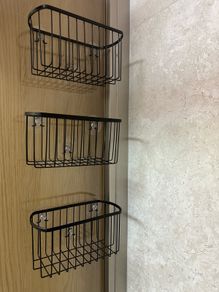 Glass-mounted shower caddies