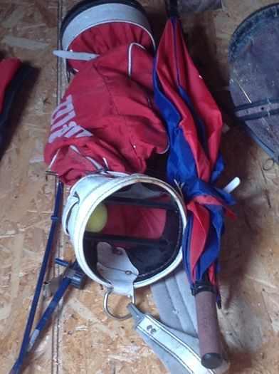 Golf bags and some golf clubs