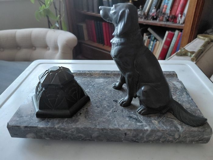 Antique desk inkwell with a seated dog on marble stand