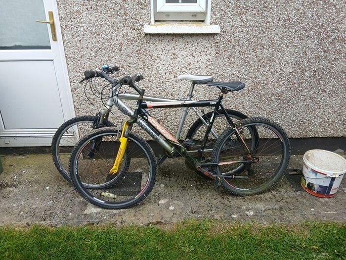 2 bikes silver one medium black one large