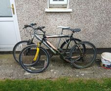2 bikes silver one medium black one large