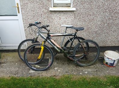 2 bikes silver one medium black one large