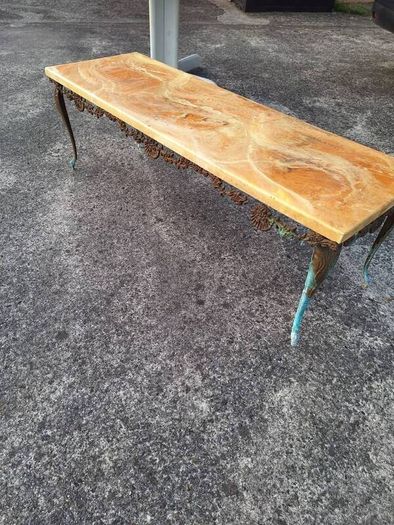Vintage metal coffee table in need of restoration
