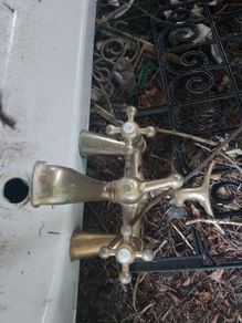 White Corner Bath with Traditional Brass Taps