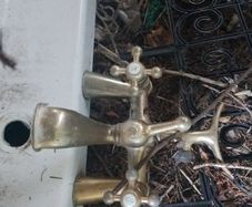 White Corner Bath with Traditional Brass Taps