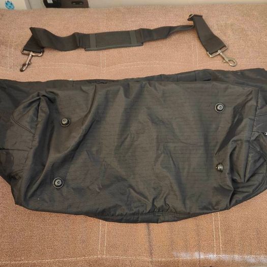 Large black expandable travel bag with shoulder strap
