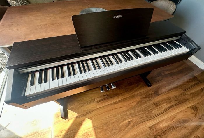 Yamaha Arius YDP-142 Digital Piano with rosewood finish and matching stool