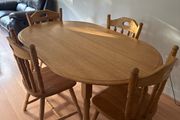 Sturdy wooden dining table and four chairs set