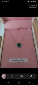 silver necklace with green stone
