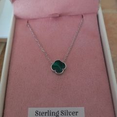 silver necklace with green stone