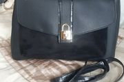 Black handbag with gold clasp.