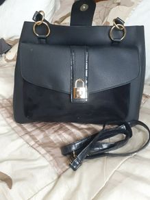 Black handbag with gold clasp.