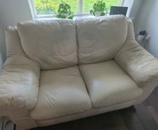 Two leather two-seater sofas for sale