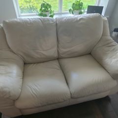 Two leather two-seater sofas for sale