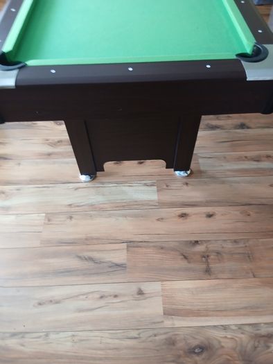 Pool table with cues and balls