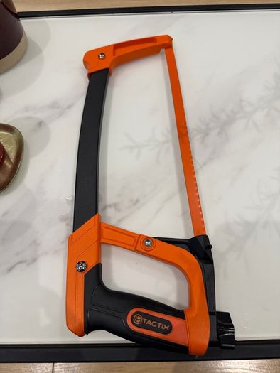 Tactix 300mm (12-inch) high-tension hacksaw with an orange and black frame