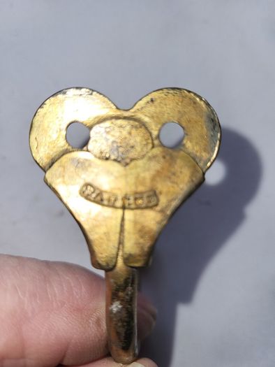 Patient brass coat hangers