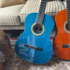 2 guitars with covers and one stand