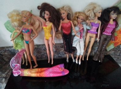 Seven Part Dressed Barbie Dolls