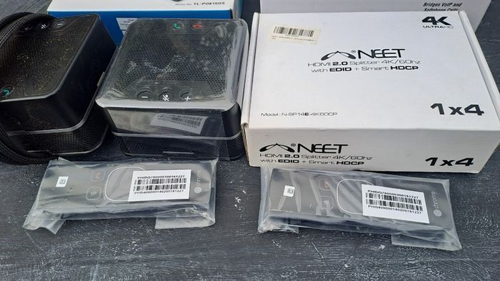 A collection of Conference Phone, Remotes, Splitter