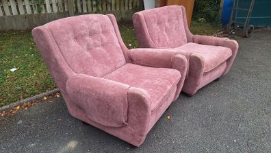 This is a vintage mid-century blush pink dralon armchair with button-tufted back detailing from the 1970s.
