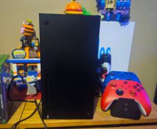 Xbox Series X console with controllers and games