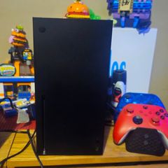 Xbox Series X console with controllers and games