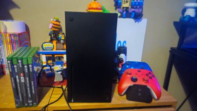 Xbox Series X console with controllers and games