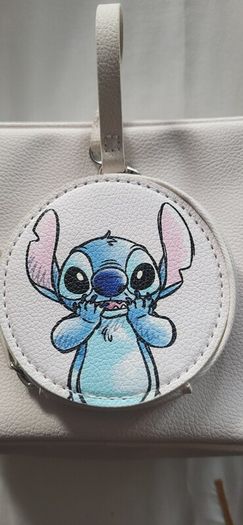 Stitch crossbody bag with matching purse.