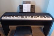 Korg electric piano . Comes with original piano stool.. original packing.