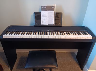 Korg electric piano . Comes with original piano stool..