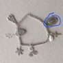 Vintage sterling silver bracelet with charms. Please note that only one charm is not sterling silver. It is a small size, approximately 16/17 cm. Image 7