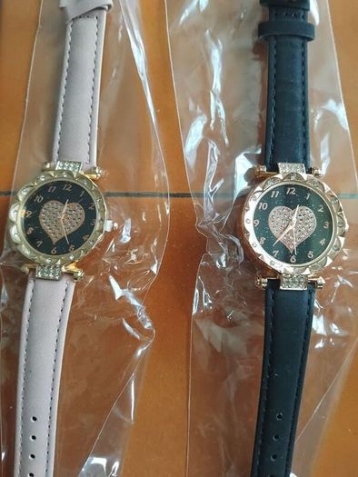 2 womens watches with leather straps