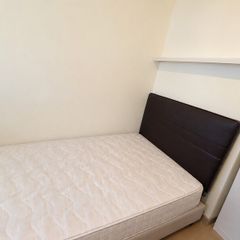 Single bed with headboard