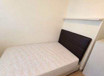 Single bed with headboard