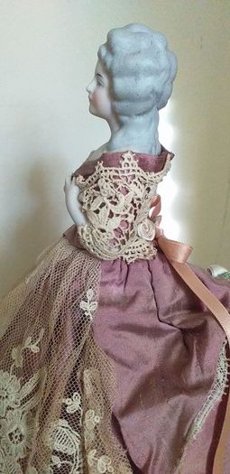 antique half pin doll with skirt