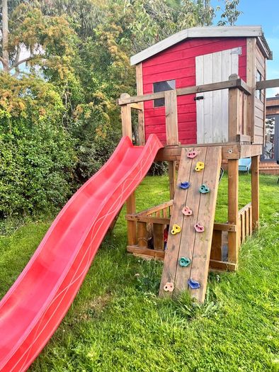 Play house with slide and climbing wall