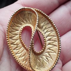 Vintage gold tone brooch.