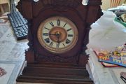 Lovely Ansonia New York Victorian Bracket clock ca 1880s. Original Enamel Dial and fine ornate black hands. 8 day gong striking Ansonia movement. Carved stepped base ornate case with gold tone brass bezel and pillars either side of the front. Good conditi