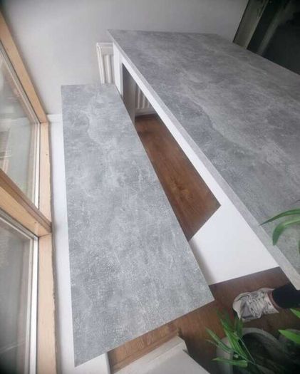 White and grey kitchen table with benches