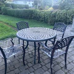 Cast Iron Garden table and 4 chairs