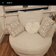 OPEN TO REASONABLE OFFERS.... PRICE DROP SWIVEL ARM CHAIR brand new with matching cushions   cost 950 selling reluctantly 400 due to moving to smaller  house