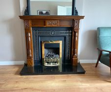Wooden fireplace includes hearth